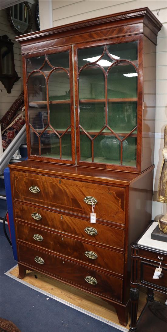 A George III inlaid mahogany secretaire chest, with later bookcase top W.108cm